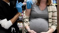  A pregnant woman receives a vaccine for the coronavirus disease (COVID-19) at Skippack Pharmacy in Schwenksville, Pennsylvania, U.S.
