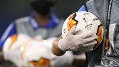 Ball boys wearing protective gloves bring the balls prior the UEFA Europa League quarter-final football match Shakhtar Donetsk v FC Basel at the Arena Aufschalke on August 11, 2020 in Gelsenkirchen, western Germany. (Photo by Lars Baron / various sources 