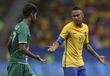 Neymar (BRA) (R) of Brazil reacts with Alaa Ali (IRQ) of Iraq.
