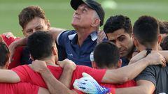 Iran's Portuguese coach Carlos Queiroz (C) looks up as he gathers with the players during a training session at the Al Rayyan SC in the Al Rayyan district in Doha on November 19, 2022, ahead of the Qatar 2022 World Cup football tournament. (Photo by FADEL SENNA / AFP) (Photo by FADEL SENNA/AFP via Getty Images)