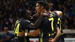 Mario Mandzukic (back) of Juventus celebrates with his team-mates Blaise Matuidi (L) and Cristiano Ronaldo (R) after scoring the opening goal during the serie A match between Parma Calcio and Juventus at Stadio Ennio Tardini on September 1, 2018 in Parma,