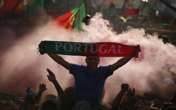 Fans of Portugal react as they watch the Euro 2016 final between Portugal and France at a public screening in Lisbon, Portugal, July 10, 2016. 