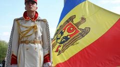 A member of the guard of honor holds the Moldovan flag during a ceremony marking the State Flag Day in Chisinau, Moldova.