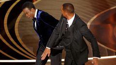 FILE PHOTO: Will Smith (R) hits Chris Rock as Rock spoke on stage during the 94th Academy Awards in Hollywood, Los Angeles, California, U.S., March 27, 2022. REUTERS/Brian Snyder/File Photo/File Photo