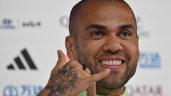 (FILES) In this file photo taken on December 1, 2022 Brazil's defender Dani Alves gives a press conference at the Qatar National Convention Center (QNCC) in Doha. - Former Barcelona defender Dani Alves will remain in preventative custody pending his trial for alleged rape as he is considered a high flight risk, the Provincial Court of Barcelona decided today. (Photo by NELSON ALMEIDA / AFP)