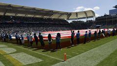 CARSON, CA - SEPTEMBER 08: A large American flag cover the field during pre-game festivities before the start of the Los Angeles Chargers season opens against Indianapolis Colts at Dignity Health Sports Park on September 8, 2019 in Carson, California.   Kevork Djansezian/Getty Images/AFP
== FOR NEWSPAPERS, INTERNET, TELCOS & TELEVISION USE ONLY ==