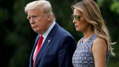 FILE PHOTO - U.S. President Donald Trump and first lady Melania Trump walk to the Marine One helicopter to depart for travel to the Kennedy Space Center in Florida from the South Lawn of the White House in Washington, U.S., May 27, 2020. REUTERS/Carlos Ba
