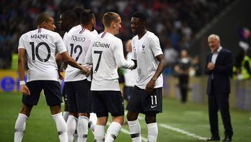 France&#039;s foward Ousmane Dembele (R) celebrates with France&#039;s foward Antoine Griezmann (2R) after scoring a goal during the friendly football match between France and Italy at the Allianz Riviera Stadium in Nice, southeastern France, on June 1, 2