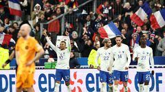 France's forward Kylian Mbappe (L) celebrates with teammates after scoring his team's fourth goal during the UEFA Euro 2024 qualification football match between France and Netherlands at the Stade de France in Saint-Denis, north of Paris, on March 24, 2023. (Photo by Anne-Christine POUJOULAT / AFP)