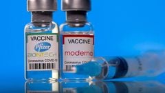 FILE PHOTO: Vials with Pfizer-BioNTech and Moderna coronavirus disease (COVID-19) vaccine labels are seen in this illustration picture taken March 19, 2021. REUTERS/Dado Ruvic/Illustration/File Photo