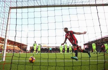 Callum Wilson of AFC Bournemouth celebrates as Steve Cook of AFC Bournemouth scores their third goal