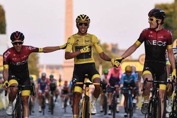 Spain's Jonathan Castroviejo (left) and Great Britain's Geraint Thomas (right) congratulate Egan Bernal on the finishing line of the 21st and last stage of the 106th edition of the Tour de France