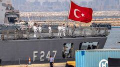 The Turkish national flag flies on the stern of the Turkish Navy Turkish frigate (F-247) TCG Kemalreis as seamen stand aboard the deck while docked at Israel's northern port of Haifa during a NATO naval exercise on September 3, 2022. - The TCG Kemalreis is the first Turkish naval ship to arrive in Israel since ties ruptured in 2010, following a confrontation between Israeli special forces and Turkish peace activists aboard a civilian vessel that had tried to breach the naval blockade on the Gaza Strip. The ship, along with other NATO vessels, are expected to remain in Israel for several days. (Photo by JACK GUEZ / AFP) (Photo by JACK GUEZ/AFP via Getty Images)