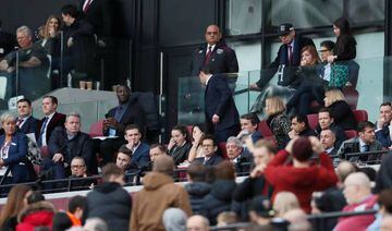 West Ham United fans remonstrate with co chairman David Sullivan as vice chairman Karren Brady looks on