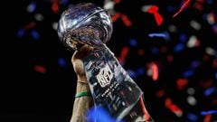 ATLANTA, GA - FEBRUARY 03: A detail of a New England Patriots player raising the Vince Lombardi Trophy after the Patriots defeat the Los Angeles Rams 13-3 during Super Bowl LIII at Mercedes-Benz Stadium on February 3, 2019 in Atlanta, Georgia.  (Photo by Kevin C. Cox/Getty Images)