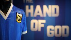 (FILES) In this file photo taken on April 20, 2022 a football shirt worn by Argentina's Diego Maradona during the 1986 World Cup quarter-final match against England, is pictured during a photocall at Sotheby's auction house in London ahead of its sale. - The jersey that Argentina football legend Diego Maradona wore when scoring twice against England in the 1986 World Cup, including the infamous "hand of God" goal, was auctioned for $9.3 million, a record for any item of sports memorabilia, Sotheby's said May 4, 2022. (Photo by ADRIAN DENNIS / AFP)