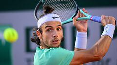 Italy's Lorenzo Musetti plays a backhand return to Britain's Cameron Norrie during their men's singles match on day six of the Roland-Garros Open tennis tournament at the Court Simonne-Mathieu in Paris on June 2, 2023. (Photo by Emmanuel DUNAND / AFP)