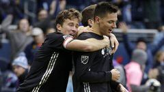 Sporting Kansas City&#039;s Matt Besler, left, and Daniel Salloi, right, celebrate their 4-2 win over Real Salt Lake at the end of a MLS Western Conference semifinals soccer match in Kansas City, Kan., Sunday, Nov. 11, 2018. (AP Photo/Colin E. Braley)
