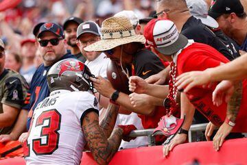 Oct 24, 2021; Tampa, Florida, USA; Tampa Bay Buccaneers wide receiver Mike Evans (13) unknowingly gives away quarterback Tom Bradyâs (12) (not pictured) 600 touchdown pass ball to a fan in the first half against the Chicago Bears at Raymond James Stadiu