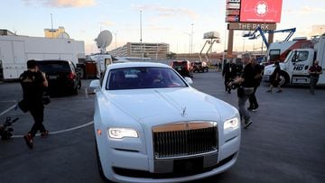 Conor McGregor arrives in a white Rolls Royce.