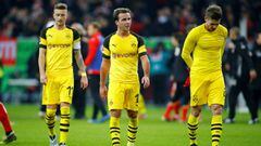 Borussia Dortmund&#039;s Marco Reus, Mario Goetze and Lukasz Piszczek react after the match 