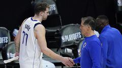 FILE- In this Sunday, June 6, 2021, file photo, Dallas Mavericks guard Luka Doncic (77) slaps hands with owner Mark Cuban after losing in Game 7 of an NBA basketball first-round playoff series against the Los Angeles Clippers in Los Angeles, Calif. Cuban 