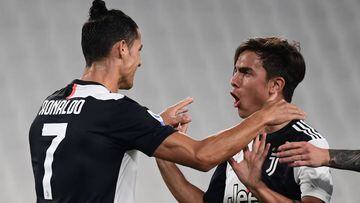 Juventus&#039; Argentine forward Paulo Dybala (R) celebrates with Juventus&#039; Portuguese forward Cristiano Ronaldo after opening the scoring during the Italian Serie A football match Juventus vs Lecce played on June 26, 2020 behind closed doors at the 