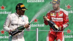 Hamilton con Vettel en el podio.