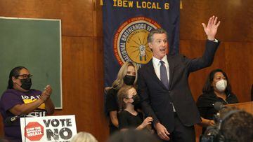 California Gov. Gavin Newsom waves to supporters after speaking to union workers and volunteers on election day at the IBEW Local 6 union hall on September 14, 2021 in San Francisco.
