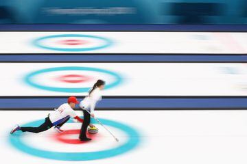 Matt Hamilton and Becca Hamilton compete during the Curling Mixed Doubles