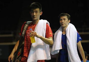 Chen Long and Ng Ka Long leave the court together after the shock result.