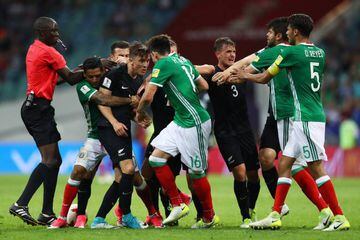 New Zealand and Mexico players clash during their Confederations Cup match.