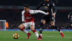 (FILES) This file photo taken on December 02, 2017 shows Manchester United&#039;s Argentinian defender Marcos Rojo fouls Arsenal&#039;s Chilean striker Alexis Sanchez during the English Premier League football match between Arsenal and Manchester United at the Emirates Stadium in London on December 2, 2017.  Arsene Wenger admitted on January 12, 2018 that Alexis Sanchez&#039;s future is up in the air as Jose Mourinho and Pep Guardiola stayed tight-lipped over potential moves for the forward during the January transfer window.   / AFP PHOTO / Adrian DENNIS / RESTRICTED TO EDITORIAL USE. No use with unauthorized audio, video, data, fixture lists, club/league logos or &#039;live&#039; services. Online in-match use limited to 75 images, no video emulation. No use in betting, games or single club/league/player publications.  / 