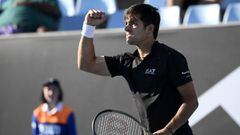 Cristian Garin of Chile reacts during his second round match against Pedro Martinez of Spain at the Australian Open tennis championships in Melbourne, Australia, Wednesday, Jan. 19, 2022. (AP Photo/Andy Brownbill)