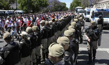 Security forces stand guard as River Plate's supporters leave the Monumental stadium in Buenos Aires.