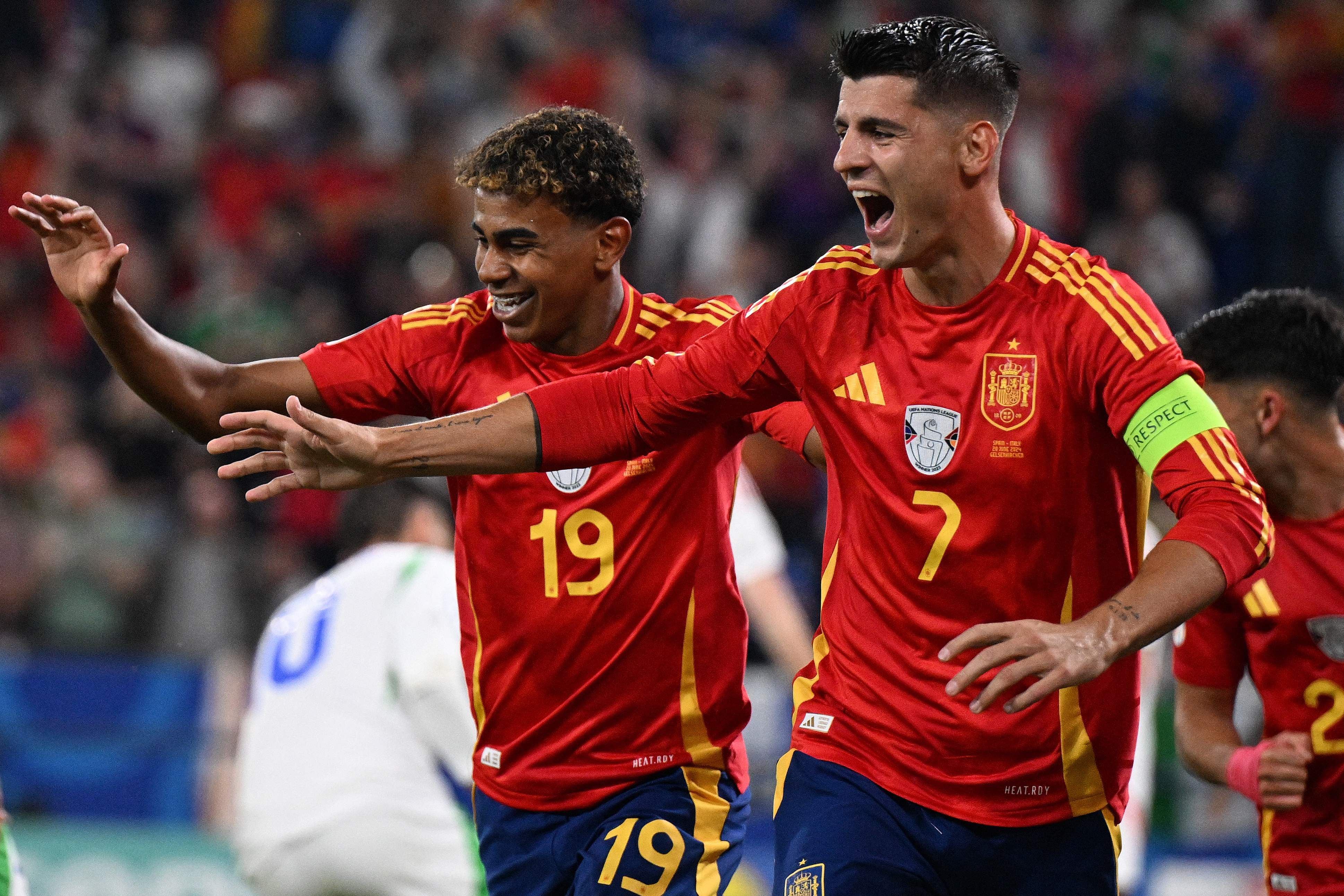 Spain's forward #19 Lamine Yamal (L) and Spain's forward #07 Alvaro Morata (C) celebrate after Italy's defender #05 Riccardo Calafiori scored an own goal during the UEFA Euro 2024 Group B football match between Spain and Italy at the Arena AufSchalke in Gelsenkirchen on June 20, 2024. (Photo by PATRICIA DE MELO MOREIRA / AFP)
