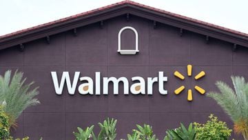 (FILES) In this file photo taken on May 23, 2019 a Walmart store logo is seen on the building of a Walmart Supercenter in Rosemead, California. - At least two people were killed and four wounded in a shooting at a Walmart distribution center in California
