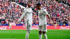 Real Madrid&#039;s Spanish defender Sergio Ramos (L) celebrates with Real Madrid&#039;s Spanish midfielder Lucas Vazquez after scoring a penalty during the Spanish league football match between Club Atletico de Madrid and Real Madrid CF at the Wanda Metro