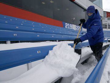 Dec 10, 2017; Orchard Park, NY, USA; Stadium personnel shovels off seats at New Era Field before a game between the Buffalo Bills and the Indianapolis Colts. Mandatory Credit: Timothy T. Ludwig-USA TODAY Sports