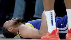 DENVER, COLORADO - FEBRUARY 02: Stephen Curry #30 of the Golden State Warriors is knocked to the floor while playing the Denver Nuggets in the fourth quarter at Ball Arena on February 2, 2023 in Denver, Colorado. NOTE TO USER: User expressly acknowledges and agrees that, by downloading and/or using this photograph, User is consenting to the terms and conditions of the Getty Images License Agreement.   Matthew Stockman/Getty Images/AFP (Photo by MATTHEW STOCKMAN / GETTY IMAGES NORTH AMERICA / Getty Images via AFP)