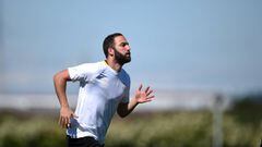 Juventus&#039; forward from Argentina Gonzalo Higuain runs during a training session on the eve of the UEFA Champion&#039;s League 2nd leg semifinal football match Juventus vs Monaco at the Vinovo training ground on May 8, 2017.  / AFP PHOTO / FILIPPO MON