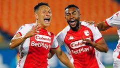 Santa Fe's forward Wilfrido De La Rosa (L) celebrates with his teammate Jhojan Torres after scoring a goal during the Copa Sudamericana first stage football match between Colombia's Aguilas Doradas Rionegro and Colombia's Independiente de Santa Fe, at the Atanasio Girardot stadium in Medellin, Colombia, on March 8, 2023. (Photo by Freddy BUILES / AFP)