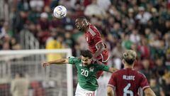 SANTA CLARA, CALIFORNIA - SEPTEMBER 27: Carlos Cuesta #4 of Columbia hits a header over Henry Martin #20 of Mexico in the first half of the Mextour Send Off at Levi's Stadium on September 27, 2022 in Santa Clara, California.   Thearon W. Henderson/Getty Images/AFP