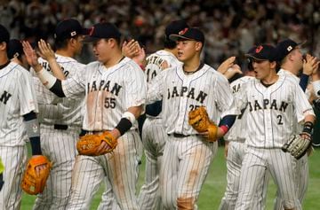 Japan's Munetaka Murakami (2-L) and Kazuma Okamoto (2-R) celebrate with teammates after defeating Italy in the 2023 World Baseball Classic quarterfinal round at Tokyo Dome in Tokyo, Japan, 16 March 2023.
