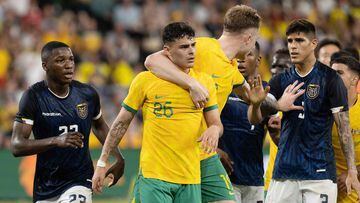 Australia�s Alexander Robertson (L) is held by teammate Harry Souttar (C) during a scuffle in the football match between Australia and Ecuador at CommBank Stadium in Sydney on March 24, 2023. (Photo by STEVE CHRISTO / AFP) / -- IMAGE RESTRICTED TO EDITORIAL USE - STRICTLY NO COMMERCIAL USE --