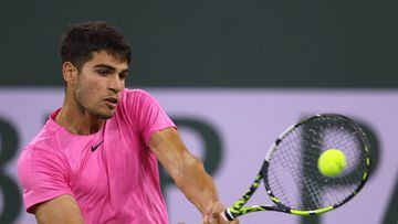 INDIAN WELLS, CALIFORNIA - MARCH 11: Carlos Alcaraz of Spain hits a backhand in his straight set win over Thanasi Kokkinakis of Australia during the BNP Parisbas Open at the Indian Wells Tennis Garden on March 11, 2023 in Indian Wells, California.   Harry How/Getty Images/AFP (Photo by Harry How / GETTY IMAGES NORTH AMERICA / Getty Images via AFP)