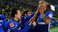 Schalke players celebrate stunning equaliser.