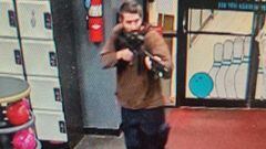 A man identified as a suspect by police points what appears to be a semiautomatic rifle, in Lewiston, Maine, U.S., October 25, 2023.    Androscoggin County Sheriff?s Office via Facebook/Handout via REUTERS    THIS IMAGE HAS BEEN SUPPLIED BY A THIRD PARTY. NO RESALES. NO ARCHIVES. MANDATORY CREDIT
