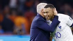 France's coach Didier Deschamps (L) and France's forward Kylian Mbapp� celebrate their team's victory after the Euro 2024 qualifying football match between the Netherlands and France at the Johan Cruijff ArenA in Amsterdam on October 13, 2023. (Photo by KENZO TRIBOUILLARD / AFP)