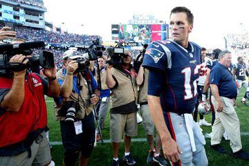 Tom Brady of the New England Patriots looks on after the Patriots defeat the Houston Texans 36-33